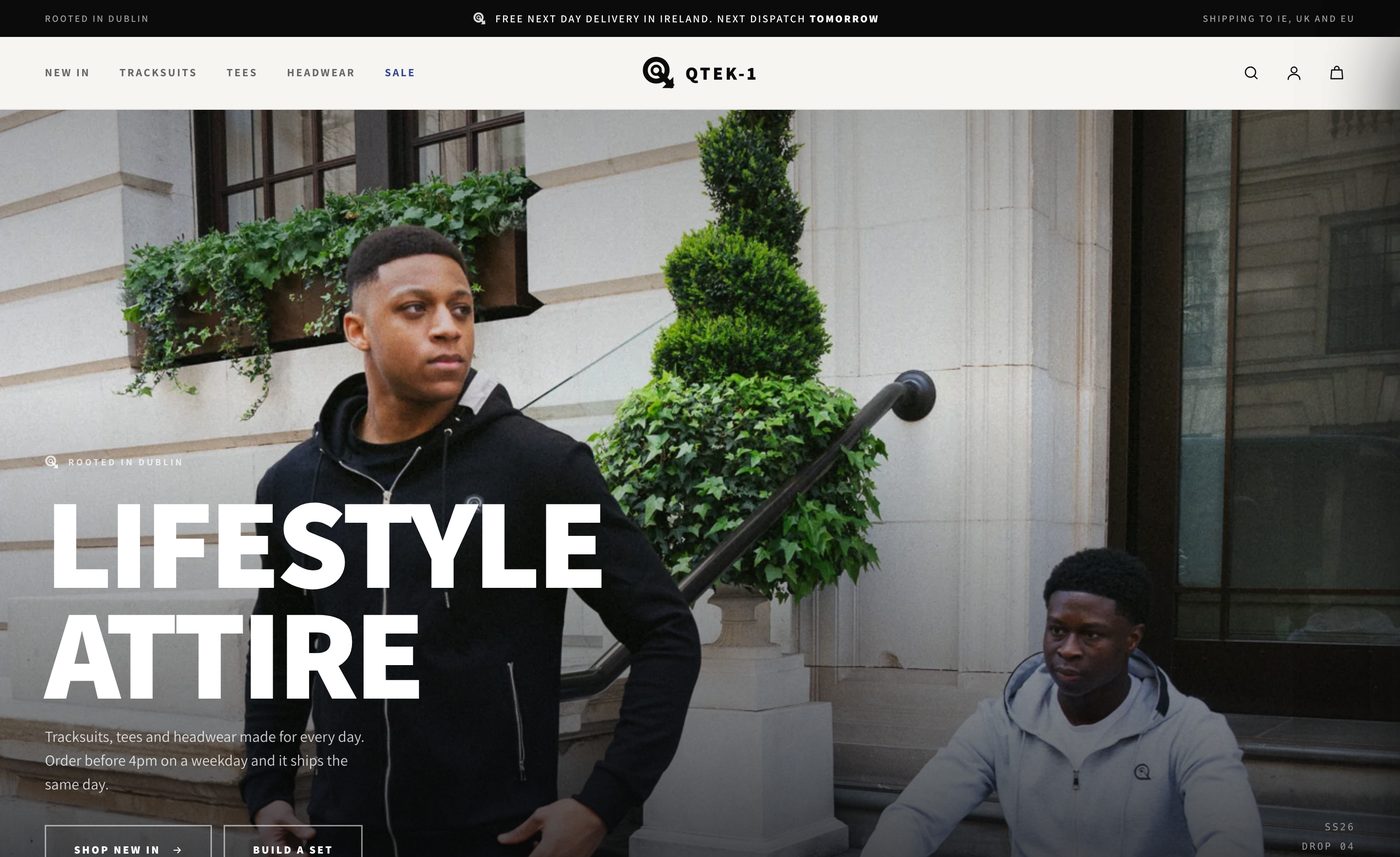 The QTEK-1 website homepage, a Dublin streetwear brand, showing a full width lifestyle photograph and the shop navigation.